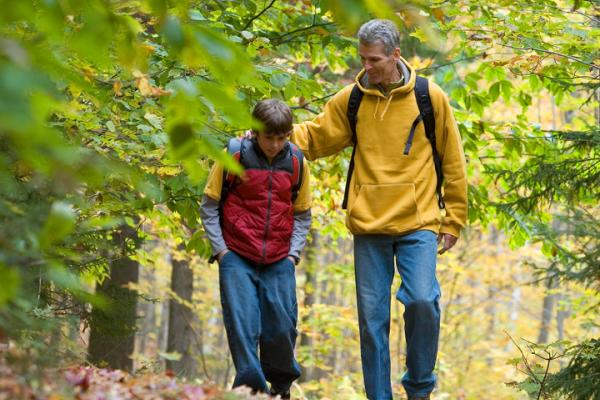 Dad and kid in woods