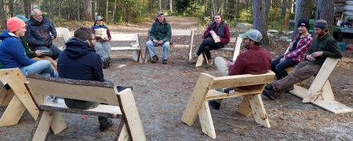 People seated on Leopold benches