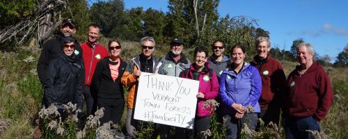 Group with sign: Thank you Vermont town forests