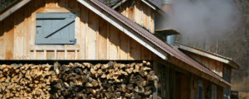 wood pile in front of sugar shack